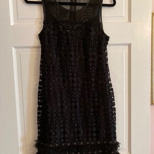 Darling black cocktail dress with underslip and  netting on top. Exposed zipper.